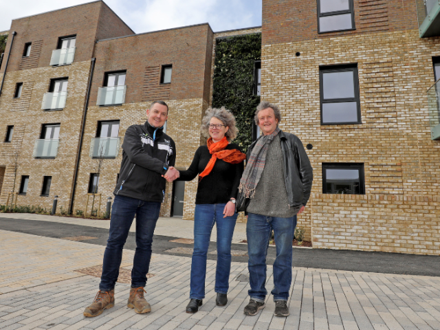 Councillor Siriol Hugh-Jones and David Gibson in front of the new homes in Victoria Road Portslade with Adrian Broadway from Morgan Sindall Construction.