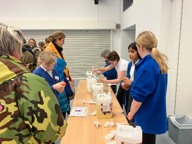 Year 6 pupils from Goldstone Primary School serving customers at their refill shop