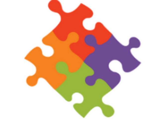 Image of a jigsaw of four colours representing the Extratime logo