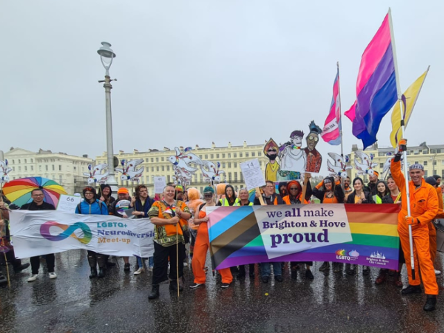 Members of the council&rsquo;s LGBTQ+ Workers Forum with banners and flags ahead of the Pride Community Parade on a wet and windy Pride Saturday in 2023