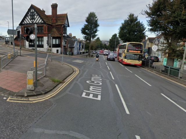a road junction with cars and a bus