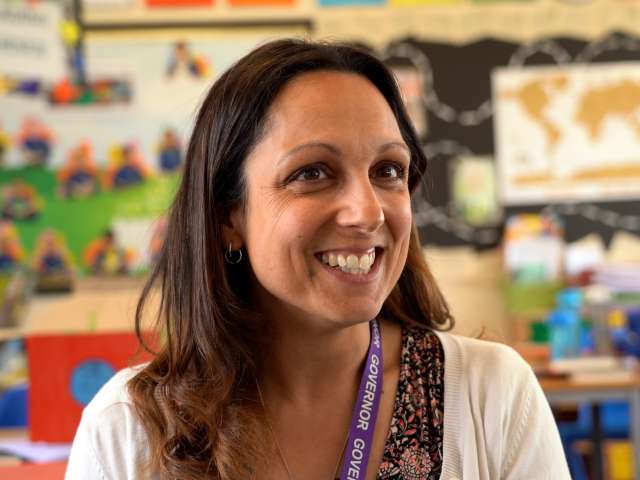 Image shows a school governor Susannah in a classroom.