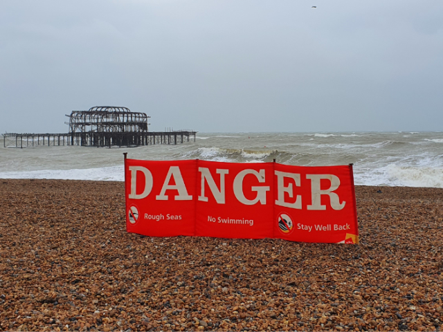 Picture of the 'Danger' windbreak on Hove beach