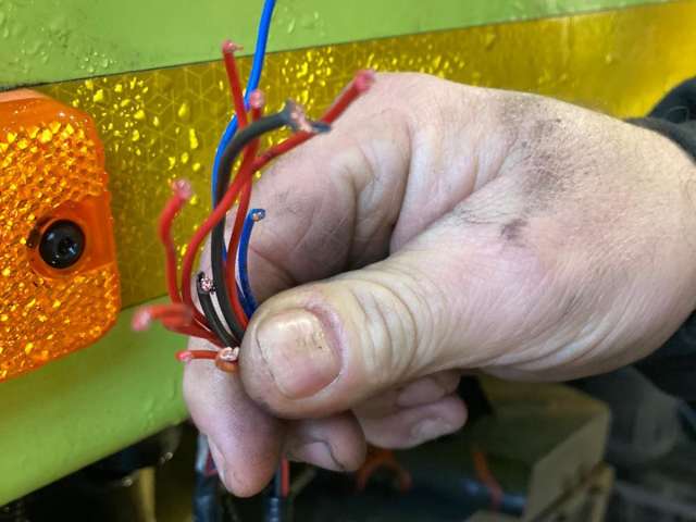image showing the wires on a lorry that have been cut