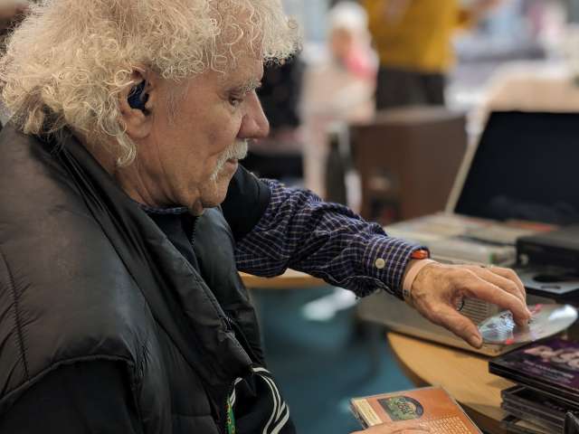DJ Jerry King putting on music at the library event 