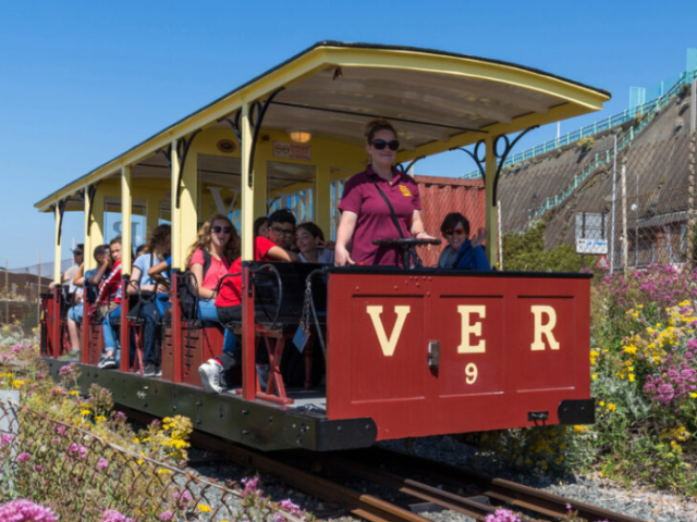 Photo of the Volk's Railway filled with passengers on a sunny day.
