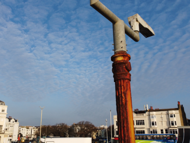 A picture of a rusted lamppost