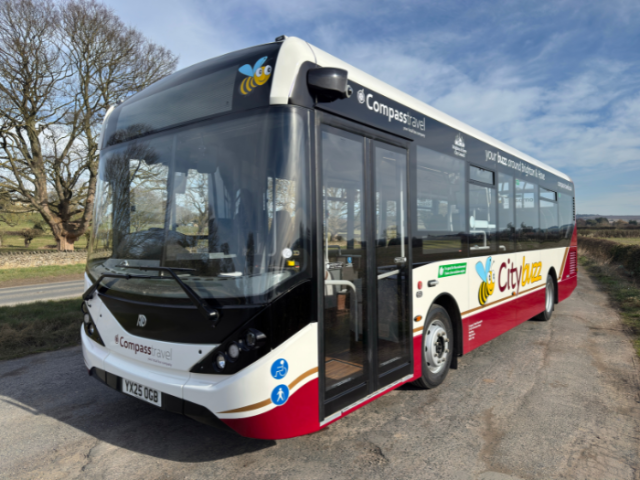 Photo of a Compass Travel bus.