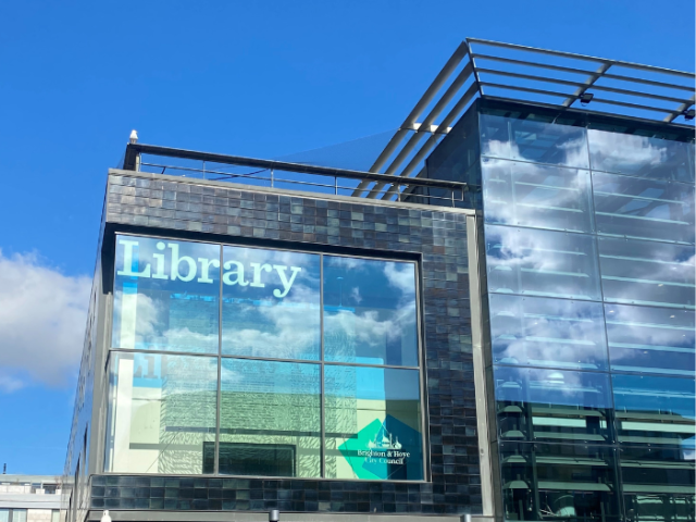 The image shows the Jubilee Library in Brighton & Hove on a lovely sunny day.