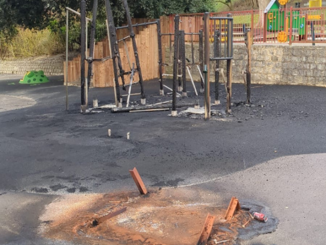 A picture of burnt out playground equipment