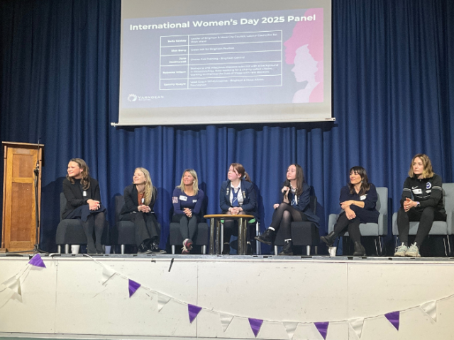 The image shows Council Leader Bella Sankey at a panel discussion with MP Sian Berry, infectious disease scientist Rebecca Wilson, professional footballer and coach Sammy Quayle and gym owner Jane Heathwood as well as two Varndean students.