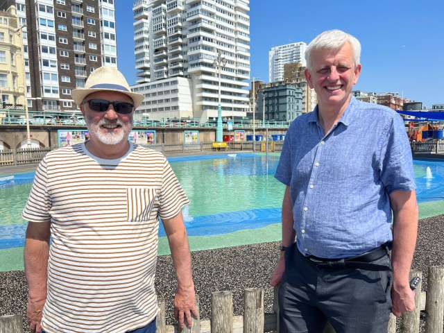 Councillor Alan Robins and Councillor Trevor Muten stood in front of the King Road Paddling Pool on the seafront