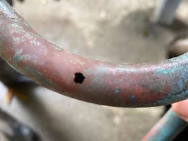 Copper water pipe with a hole