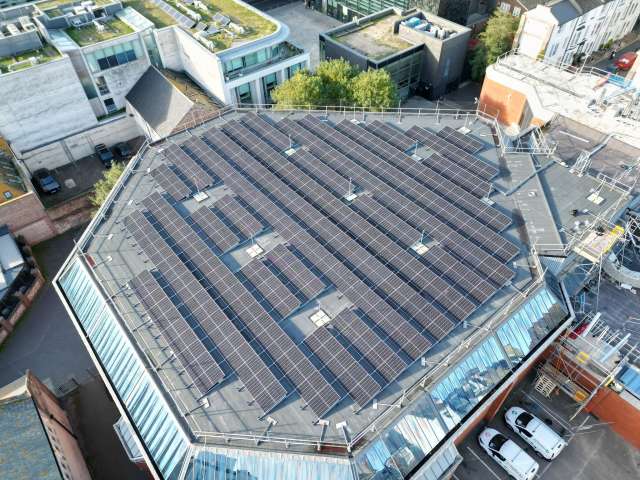 Aerial view of Prince Regent Swimming Complex covered in solar panels