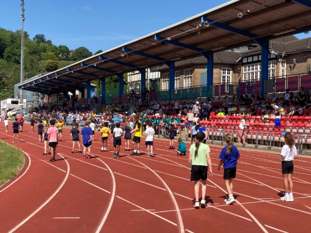 Primary pupils at an athletic event at Withdean Stadium