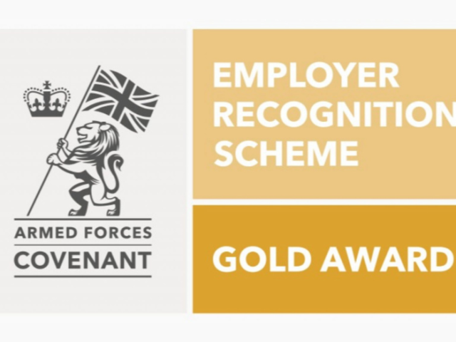 The image is a graphic of a lion bearing the union flag with a crown in the corner. The text reads: Armed Forces Covenant. Employer recognition scheme. Gold award.'