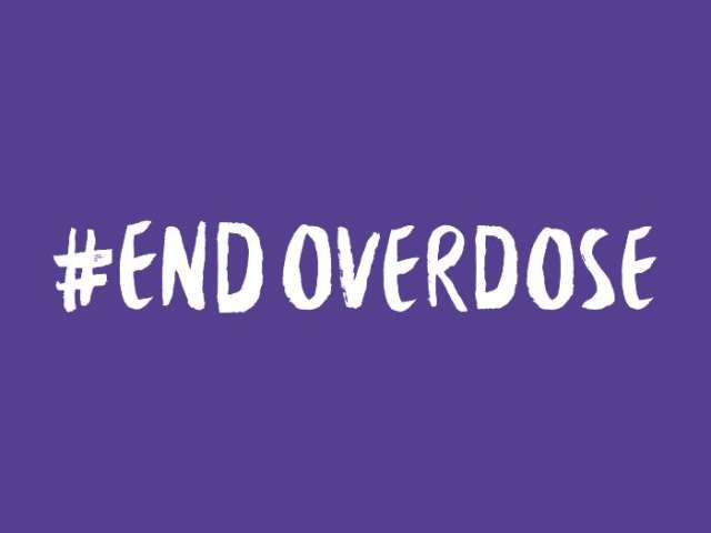 Purple background with with text. Text reads: "#End Overdose"