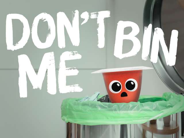 Don't bin me - with a pink yoghurt pot with a dismayed face being put into the kitchen waste bin. 