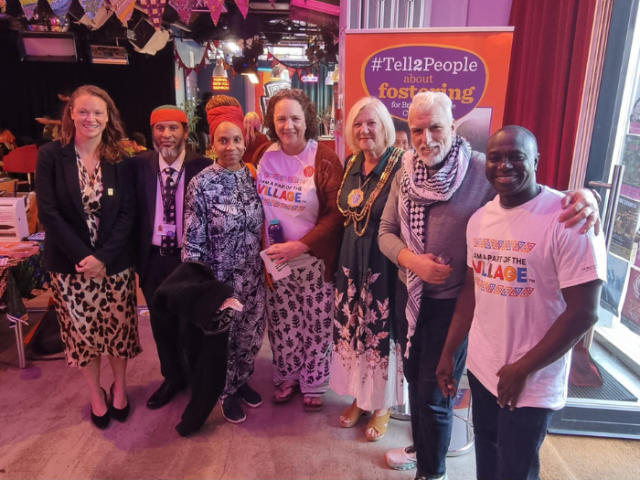 A group of people at the 'It Takes a Village' fostering event
