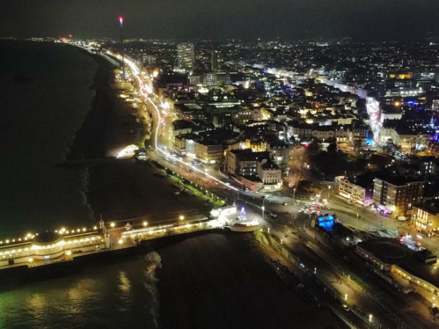 An aerial photo of Brighton seafront at nighttime