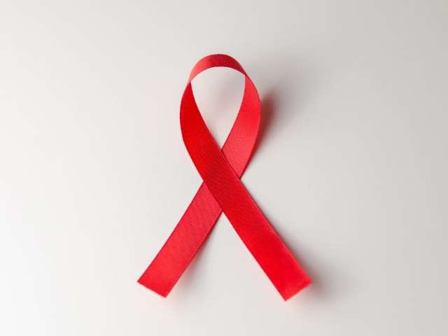 White background with a red ribbon, symbolising World AIDS Day 