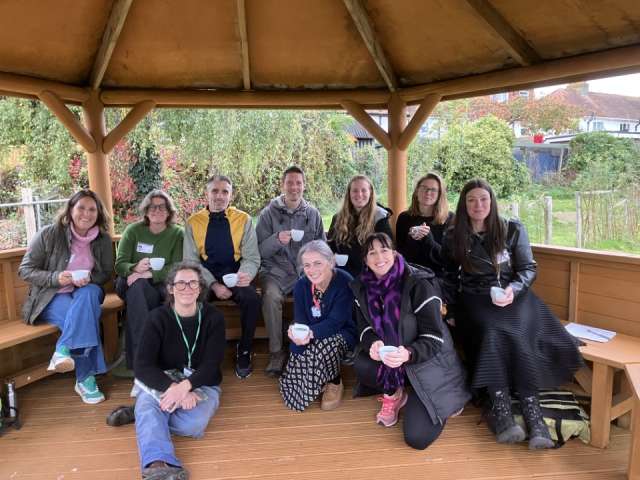 Teachers taking part in the project gathered together in a wooden garden pavilion.