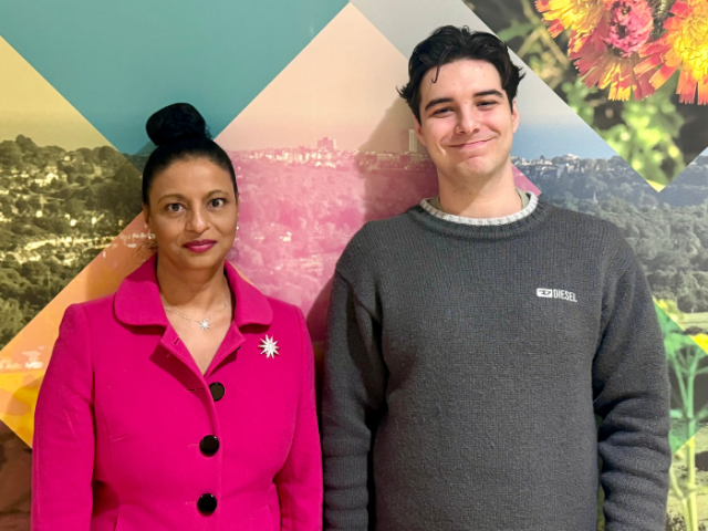 Cheryl Mehta and Lucas Allison stood in Hove Town Hall