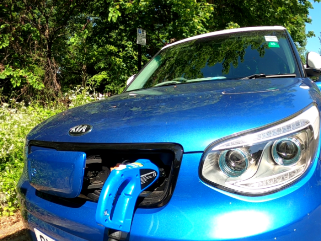 an electric vehicle being charged