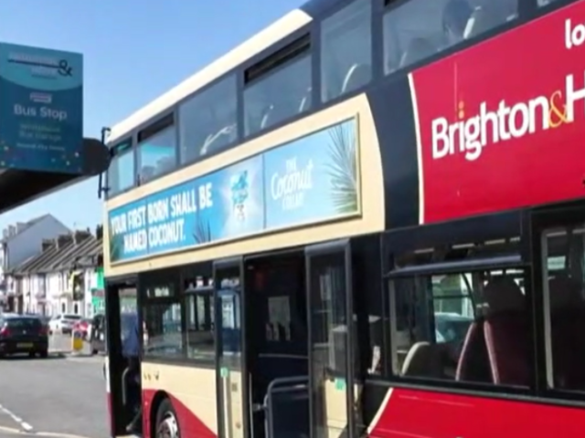 A bus sitting at a bus stop