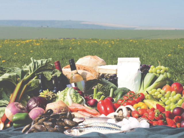 Examples of food and drink produced in Sussex laid out on the South Downs