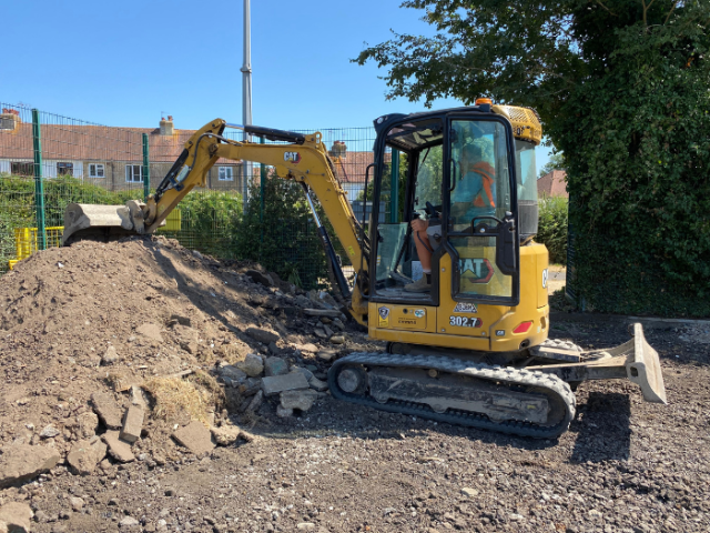 Picture of a bulldozer starting work to construct the recycled Multi Use Play Area at Knoll Park