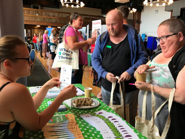 People talking about services at the What's Out There event in 2018
