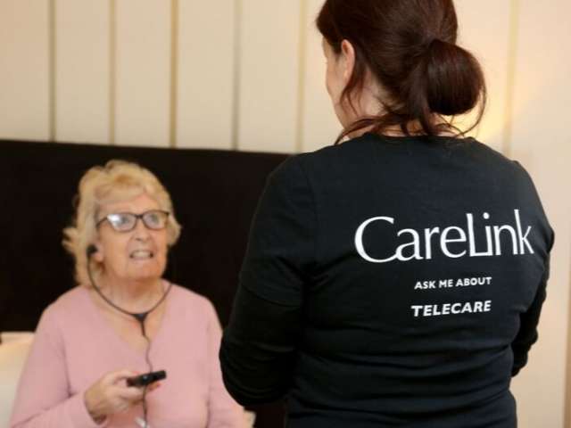Woman receiving support from Carelink Plus