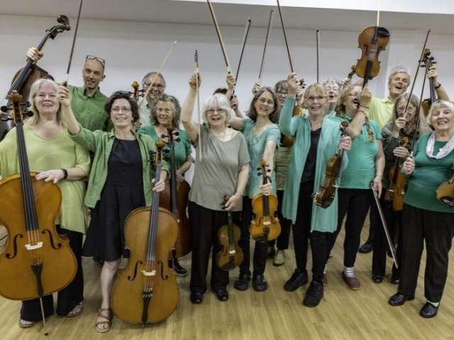 Photo of the Silver Strings music group holding their instruments