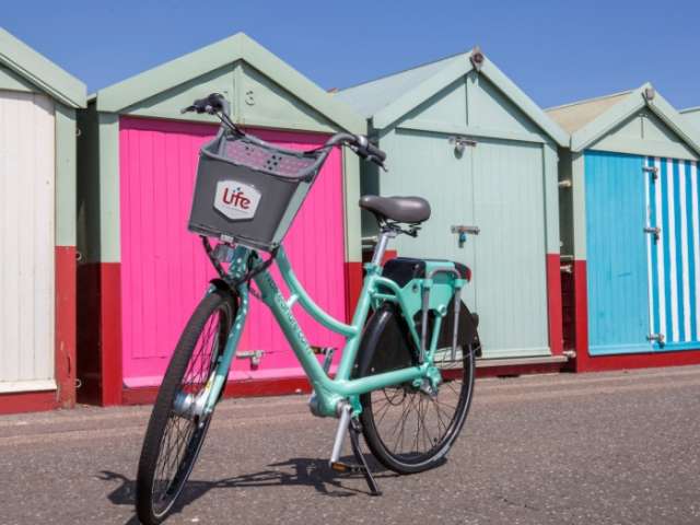Bike by the beach huts