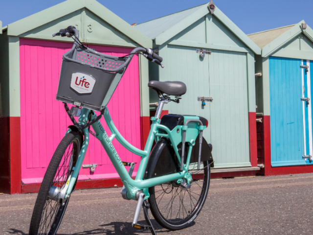 Bike by the beach huts