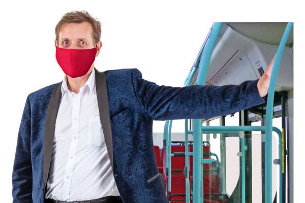 Person on bus wearing a mask.