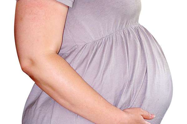 A pregnant person's stomach.