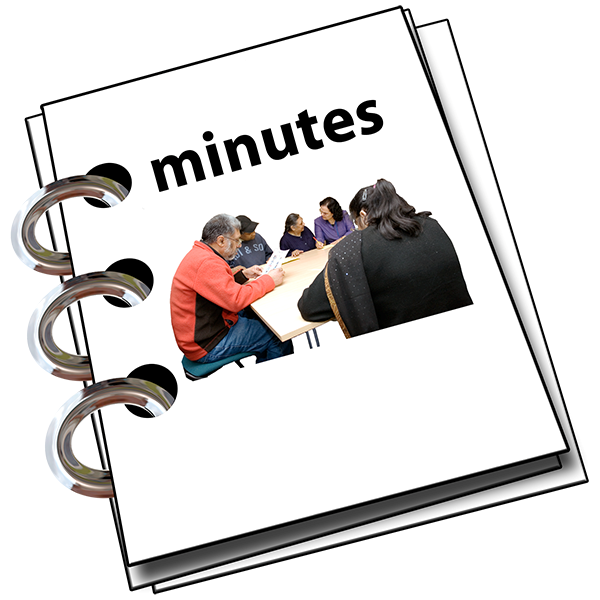 Ring binder titled minutes.