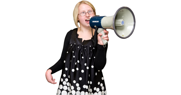 Person talking into a speakerphone.