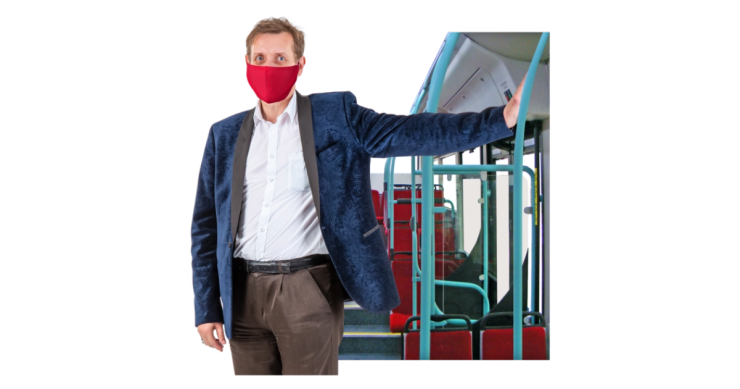 Person on bus wearing a mask.
