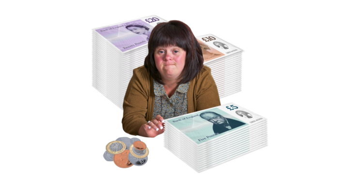 person next to money piles.