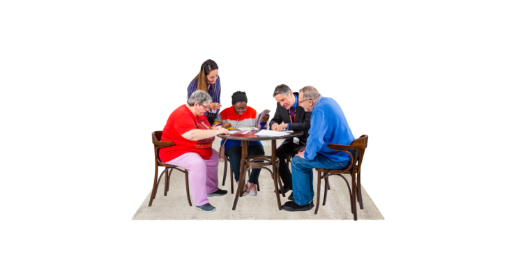Group of 5 people round a table