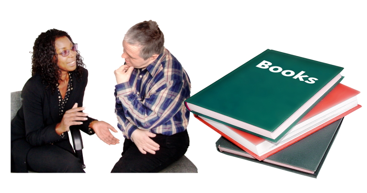 Two people talking and a stack of books.