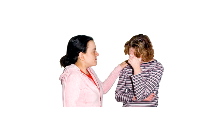 A person comforting another who is sad.
