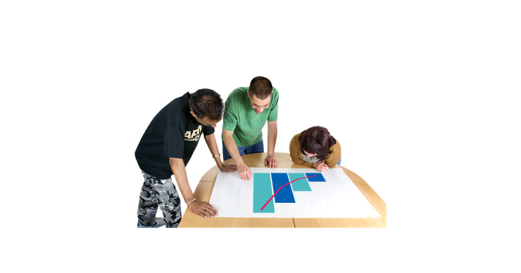 3 people working on a data chart.