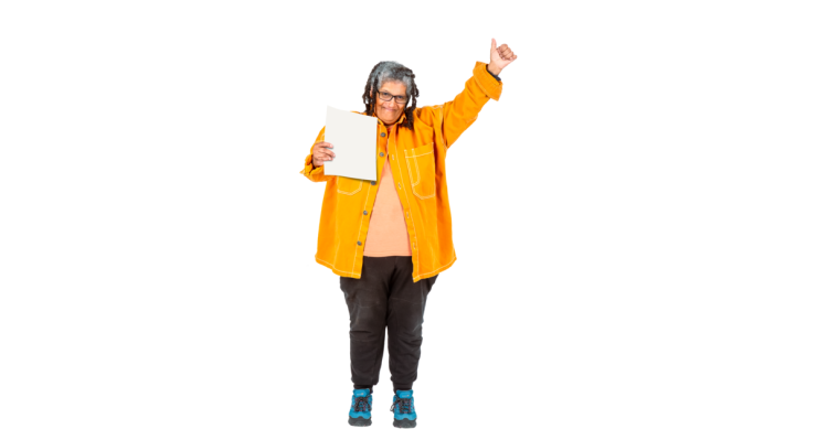 Person standing with a piece of paper in their hand smiling and holding their thumb up.