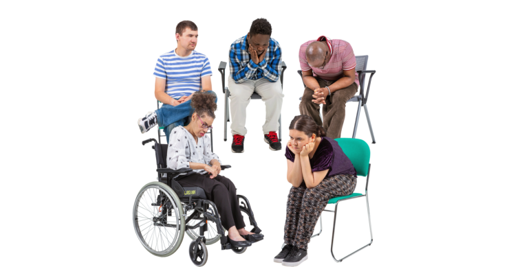 A group of people sitting down looking sad.