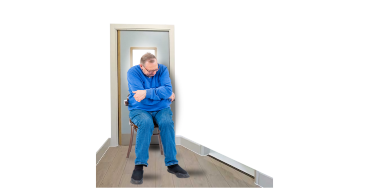 A person in a house alone looking isolated.