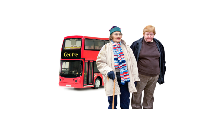 Two people standing in front of a bus.